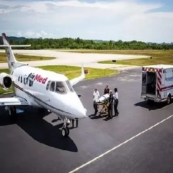 A plane taking a patient from an ambulance.